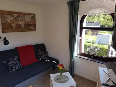 Ein Sitzbereich in der Unterkunft Ferienwohnung Wegespinne