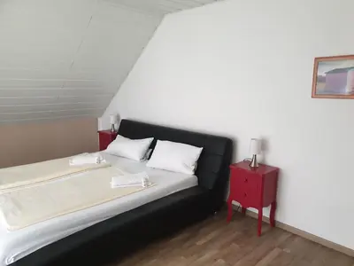 Ein Bett oder Betten in einem Zimmer der Unterkunft Lindner Ferienwohnungen und Doppelzimmer