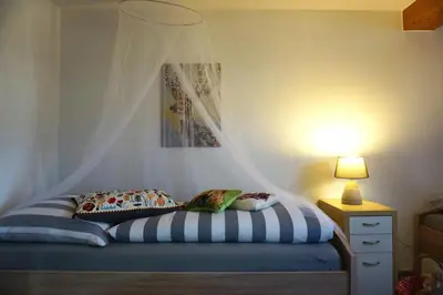 Ein Bett oder Betten in einem Zimmer der Unterkunft Ferienwohnung Schott