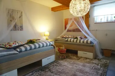 Ein Bett oder Betten in einem Zimmer der Unterkunft Ferienwohnung Schott