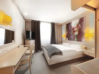 Ein Bett oder Betten in einem Zimmer der Unterkunft WAGNERS Hotel Schönblick, C&C Hotels und Vertrieb GmbH