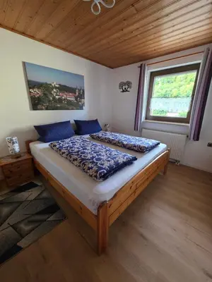 Ein Bett oder Betten in einem Zimmer der Unterkunft Kleines Waldglück in der Fränkischen Schweiz
