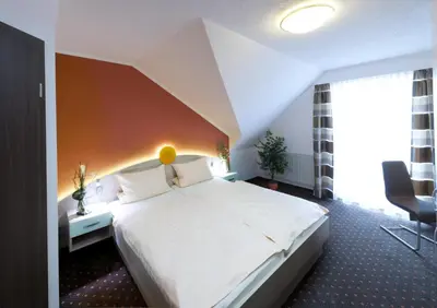 Ein Bett oder Betten in einem Zimmer der Unterkunft Hotel Sonnental