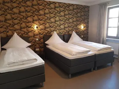 Ein Bett oder Betten in einem Zimmer der Unterkunft Boardinghouse Marktplatz