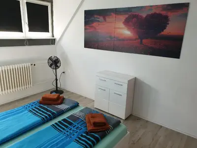 Ein Bett oder Betten in einem Zimmer der Unterkunft Großzügige Ferienwohnung in Furth im Wald
