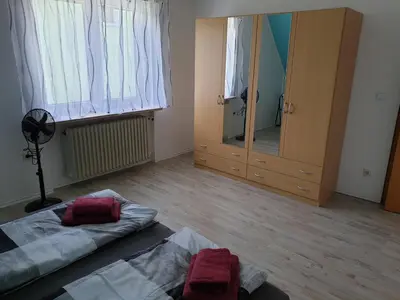 Ein Bett oder Betten in einem Zimmer der Unterkunft Großzügige Ferienwohnung in Furth im Wald