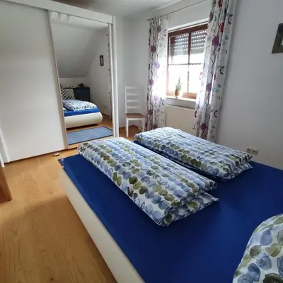 Ein Bett oder Betten in einem Zimmer der Unterkunft Ferienwohnung Adelhardt