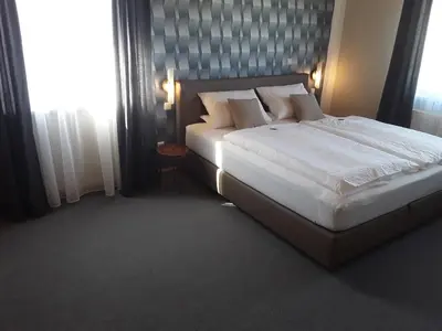 Ein Bett oder Betten in einem Zimmer der Unterkunft Wirtshaus Birkenhof