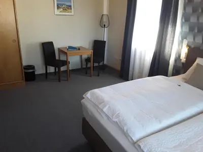 Ein Bett oder Betten in einem Zimmer der Unterkunft Wirtshaus Birkenhof