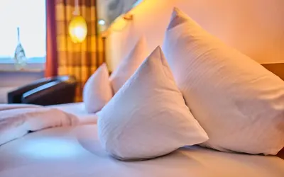 Ein Bett oder Betten in einem Zimmer der Unterkunft Hotel Wutzschleife