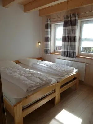 Ein Bett oder Betten in einem Zimmer der Unterkunft Ferienhaus Nr 17A3, Feriendorf Hagbügerl, Bayr Wald