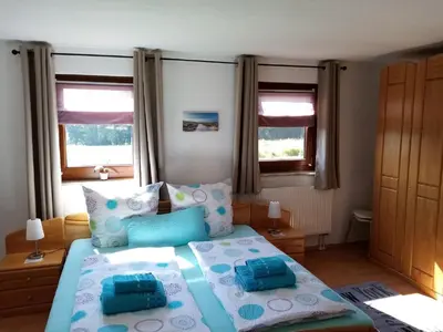 Ein Bett oder Betten in einem Zimmer der Unterkunft Ferienhaus Waldblick