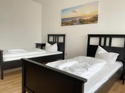 Ein Bett oder Betten in einem Zimmer der Unterkunft SAD161 - Gut geschnittene Monteurwohnung mit Balkon