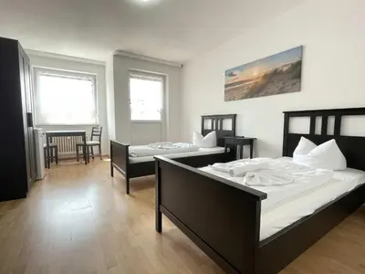 Ein Bett oder Betten in einem Zimmer der Unterkunft SAD161 - Gut geschnittene Monteurwohnung mit Balkon