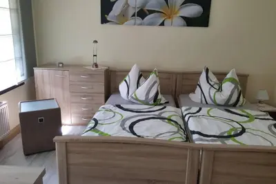 Ein Bett oder Betten in einem Zimmer der Unterkunft Sonnenblick Rittersgrün II
