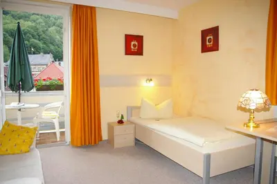 Ein Bett oder Betten in einem Zimmer der Unterkunft Hotel Heissinger
