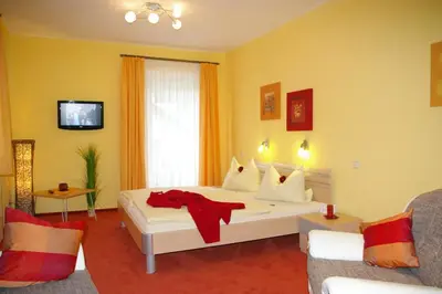 Ein Bett oder Betten in einem Zimmer der Unterkunft Hotel Heissinger