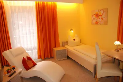 Ein Bett oder Betten in einem Zimmer der Unterkunft Hotel Heissinger