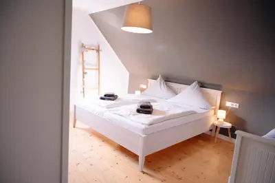 Ein Bett oder Betten in einem Zimmer der Unterkunft Ferienhaus Glücksgriff Pottenstein