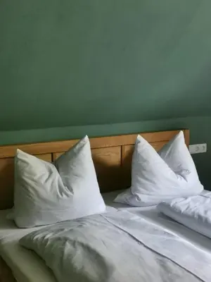 Ein Bett oder Betten in einem Zimmer der Unterkunft Ferienhaus Glücksgriff Pottenstein