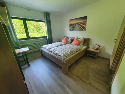Ein Bett oder Betten in einem Zimmer der Unterkunft Ferienhaus Tüchersfeld