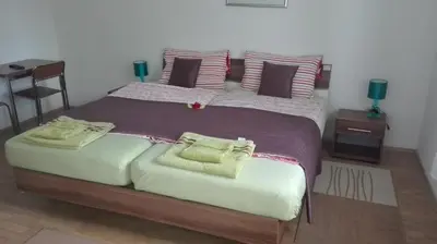 Ein Bett oder Betten in einem Zimmer der Unterkunft Hotel 