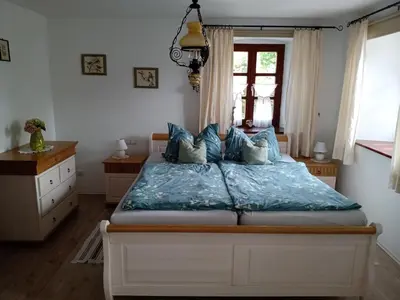 Ein Bett oder Betten in einem Zimmer der Unterkunft Ferienwohnung Tretter