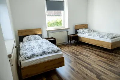 Ein Bett oder Betten in einem Zimmer der Unterkunft Schöne Ferienwohnung in Oberkotzau am Fichtelgebirge