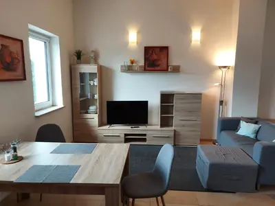 Ein Sitzbereich in der Unterkunft Apartment Business