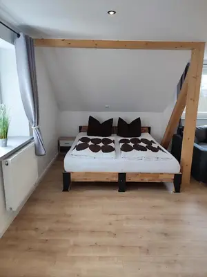 Ein Bett oder Betten in einem Zimmer der Unterkunft Kutscherhaus