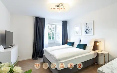 Ein Bett oder Betten in einem Zimmer der Unterkunft Sali Homes - Wahnfried No 5 City Apartment