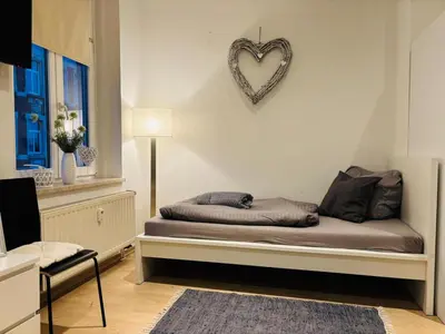 Ein Bett oder Betten in einem Zimmer der Unterkunft moderne Ferienwohnung am Stadtwald von Plauen