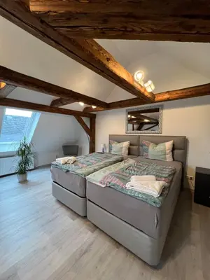 Ein Bett oder Betten in einem Zimmer der Unterkunft Ferienwohnungen Yanev