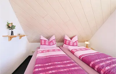 Ein Bett oder Betten in einem Zimmer der Unterkunft Ferienhaus Hangweg P