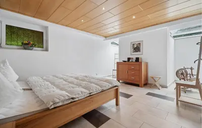 Ein Bett oder Betten in einem Zimmer der Unterkunft Ferienhaus Hennebacher Str. S