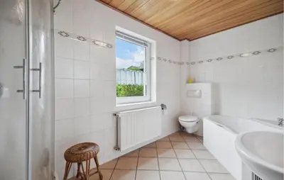 Ein Badezimmer in der Unterkunft Ferienhaus Hennebacher Str. S