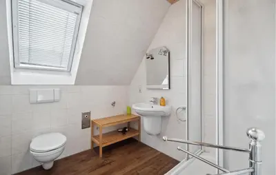 Ein Badezimmer in der Unterkunft Ferienhaus Hennebacher Str. S