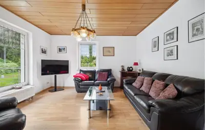 Ein Sitzbereich in der Unterkunft Ferienhaus Hennebacher Str. S