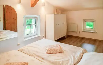 Ein Bett oder Betten in einem Zimmer der Unterkunft Ferienhaus Am Trieberweg S
