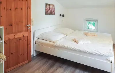Ein Bett oder Betten in einem Zimmer der Unterkunft Ferienhaus Am Trieberweg S