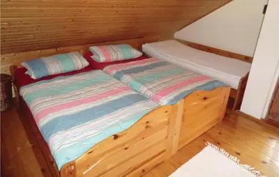 Ein Bett oder Betten in einem Zimmer der Unterkunft Ferienhaus Thiergartener Str. T