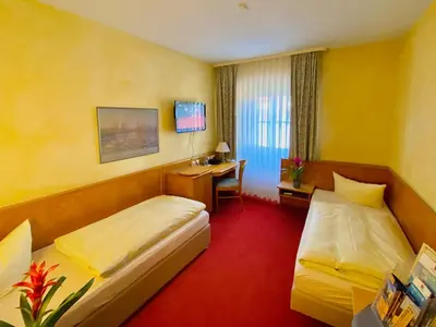 Ein Bett oder Betten in einem Zimmer der Unterkunft Meister BÄR HOTEL Ostbayern