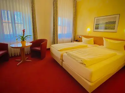 Ein Bett oder Betten in einem Zimmer der Unterkunft Meister BÄR HOTEL Ostbayern