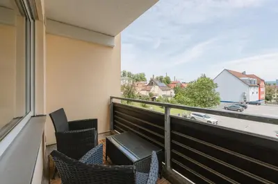 Ein Balkon oder eine Terrasse in der Unterkunft Exklusiv & Zentral: 1-Zi. Apartment mit Balkon Stellplatz