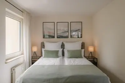 Ein Bett oder Betten in einem Zimmer der Unterkunft Exklusiv & Zentral: 1-Zi. Apartment mit Balkon Stellplatz
