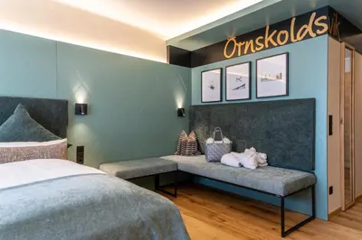 Ein Bett oder Betten in einem Zimmer der Unterkunft Hotel Jens Weissflog
