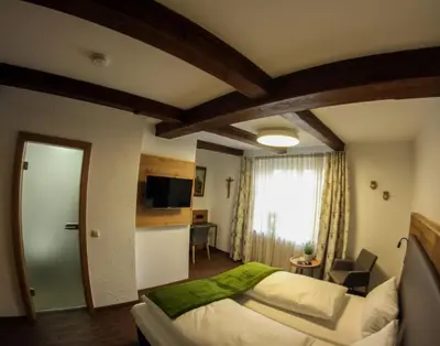 Ein Bett oder Betten in einem Zimmer der Unterkunft Hotel zum ehem. königl. Bayr. Forsthaus