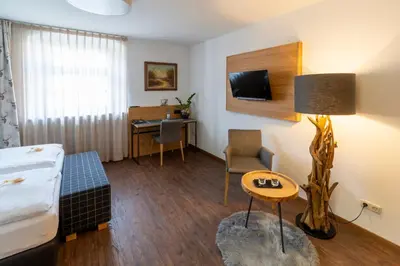 Ein Bett oder Betten in einem Zimmer der Unterkunft Hotel zum ehem. königl. Bayr. Forsthaus
