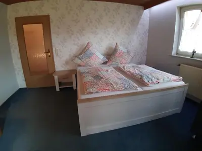 Ein Bett oder Betten in einem Zimmer der Unterkunft Ferienwohnung Elisabeth