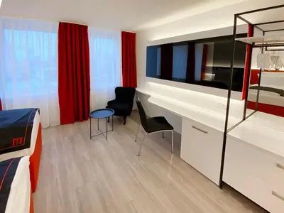 Ein Bett oder Betten in einem Zimmer der Unterkunft DORMERO Hotel Hersbruck